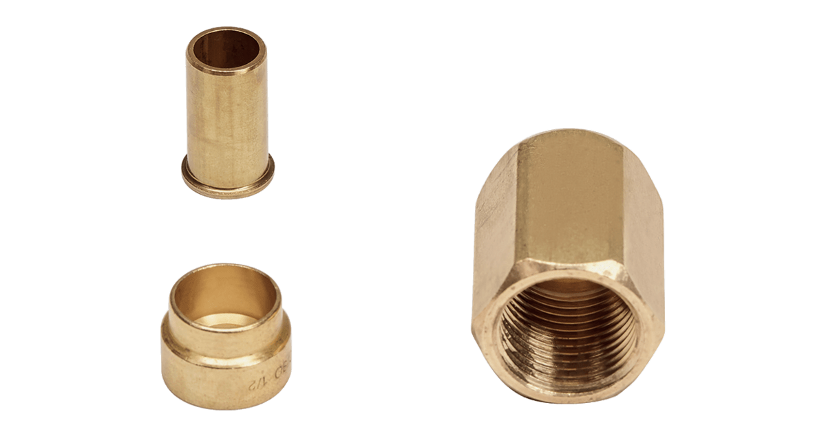 Set of brass fittings including a nut and two connectors, designed for durable plumbing applications.
