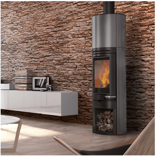 Stylish Edilkamin Tally S Evo 9,1 kW 🔥 in modern living room with stone wall and sleek furniture.